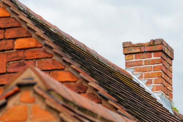 process of chimney replacement on the roof