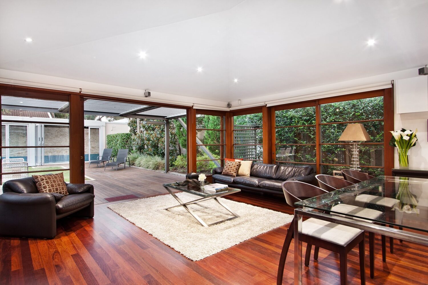 The living room as a part of the home additions Northbrook project included creating an open area that maximizes the garden connection